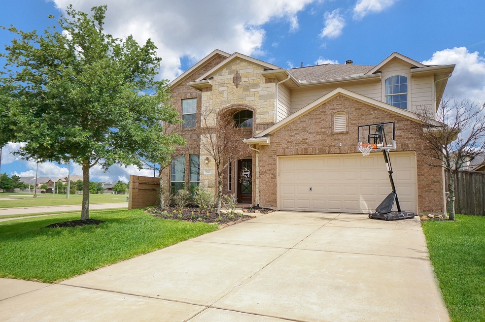 WELCOME HOME!!! Located on a large corner lot on a