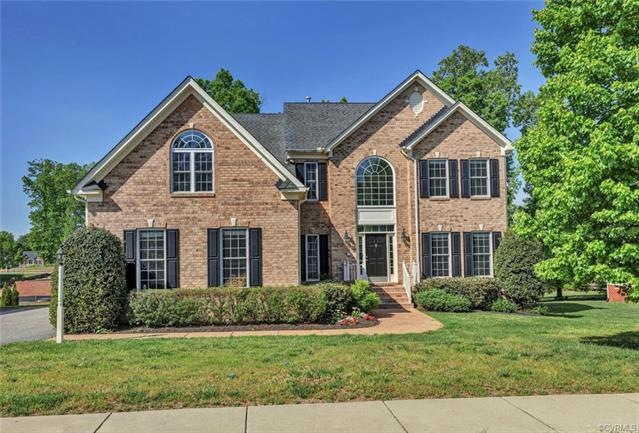 Beautiful brick front elevation with 3 car side en