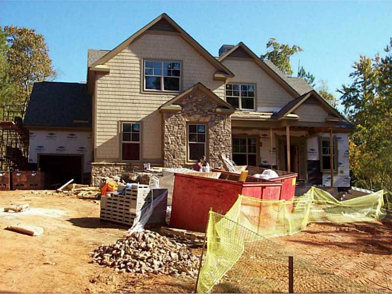 Exterior Front. 3 side brick and stone, hardi shak