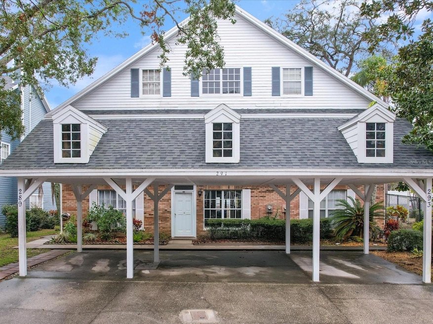 Front entry and two tandem carport spots in the center