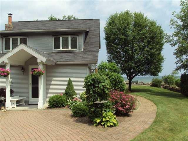 Exterior Front. Guests stroll a brick paver walkwa