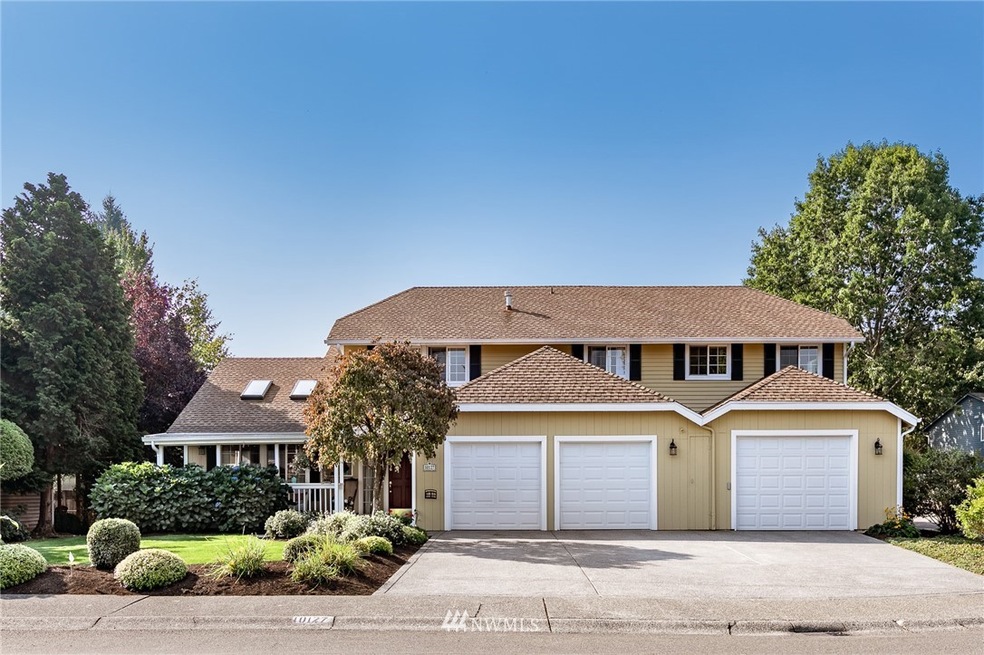 Traditional 2 story home w/ sunny, level lot & over-sized 3 car garage