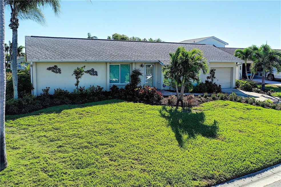 Front elevation, landscaping & paver sidewalk.