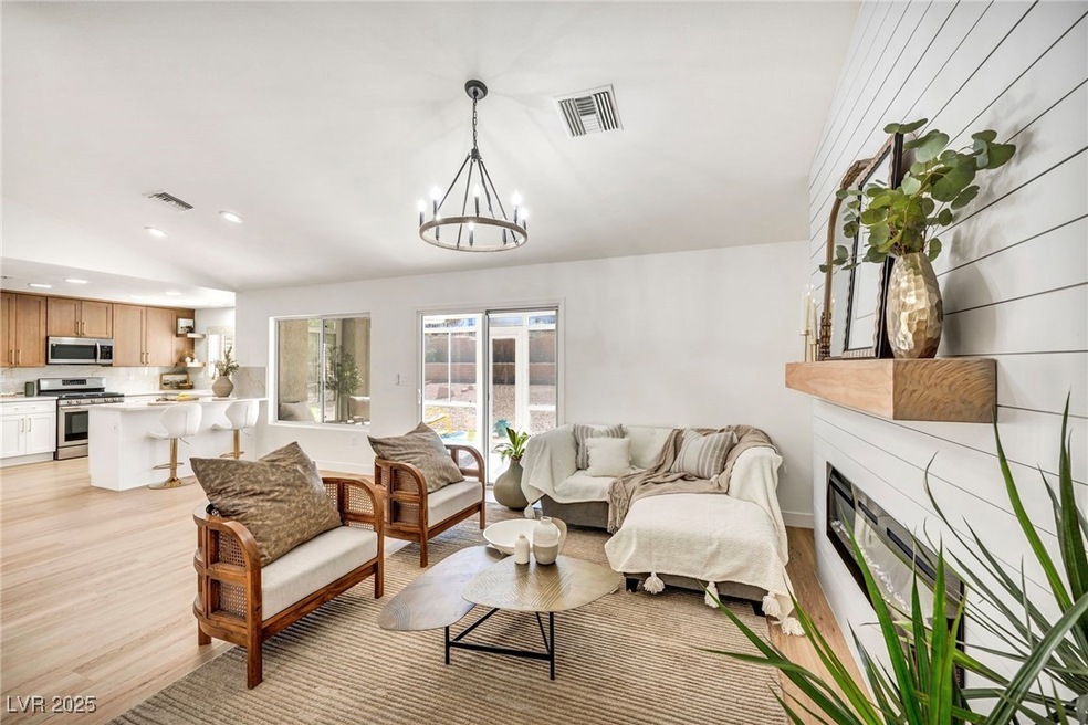Living room featuring light wood-style floors, a c