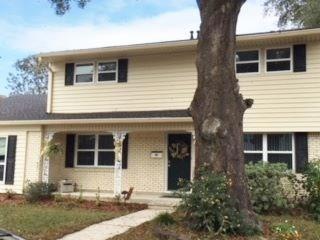 Front View of beautiful tree and front porch