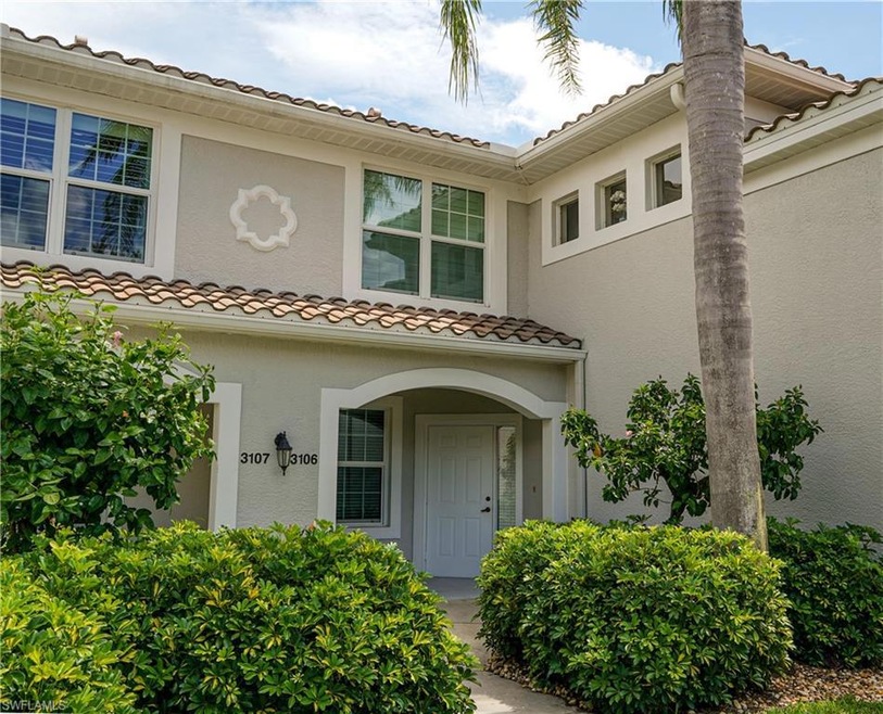 View of exterior entry featuring stucco siding and a tile roof
