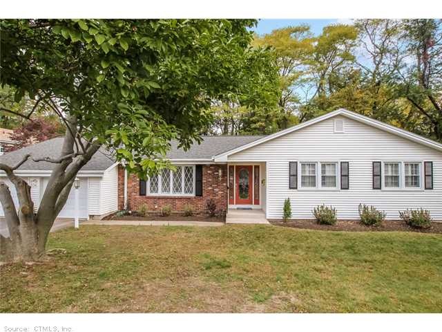 Exterior Front. Newer vinyl siding and roof. Two c