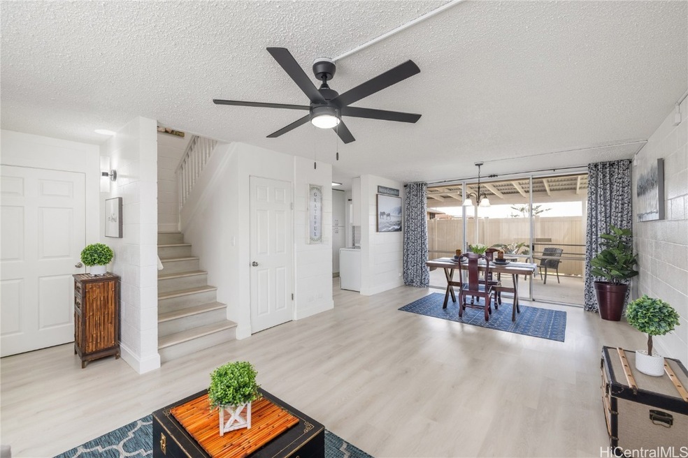 View of the living room , staircase, and dining ar