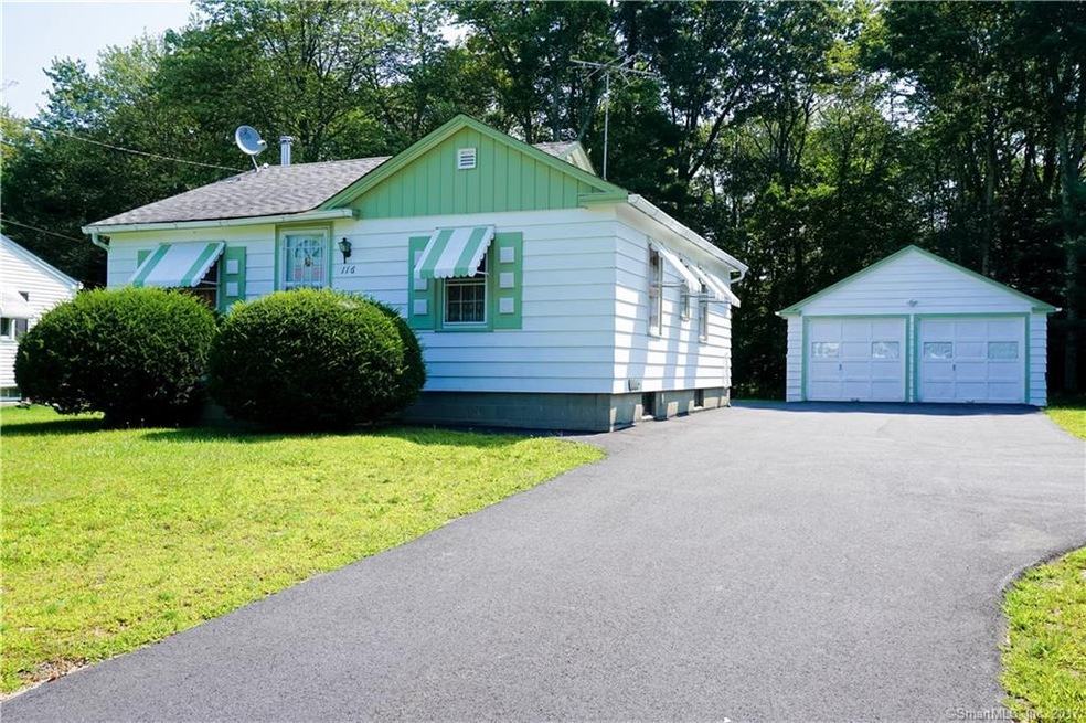 Front exterior shows detached 2 car garage