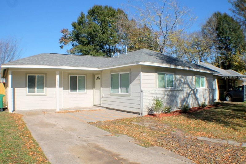 A single-story suburban house with a new roof, fre