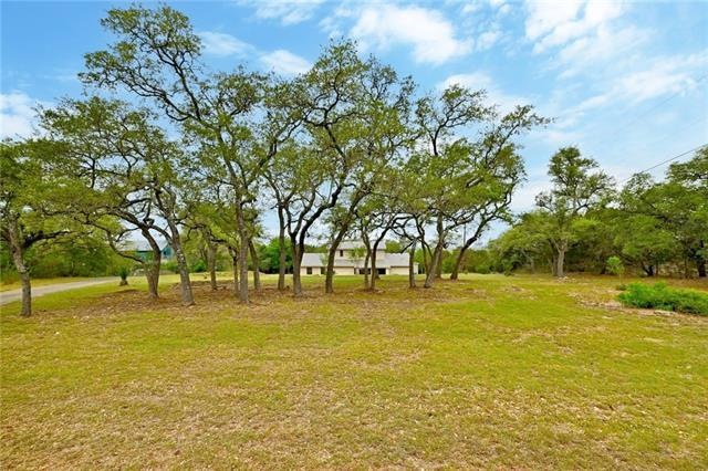 Welcome to Trail Driver! Take a look at these gorgeous Oaks in the front and backyard. The owner just paid for a professional arborist to come view and trim the trees as a way of saying thank you for all the beauty they gave over all the years!