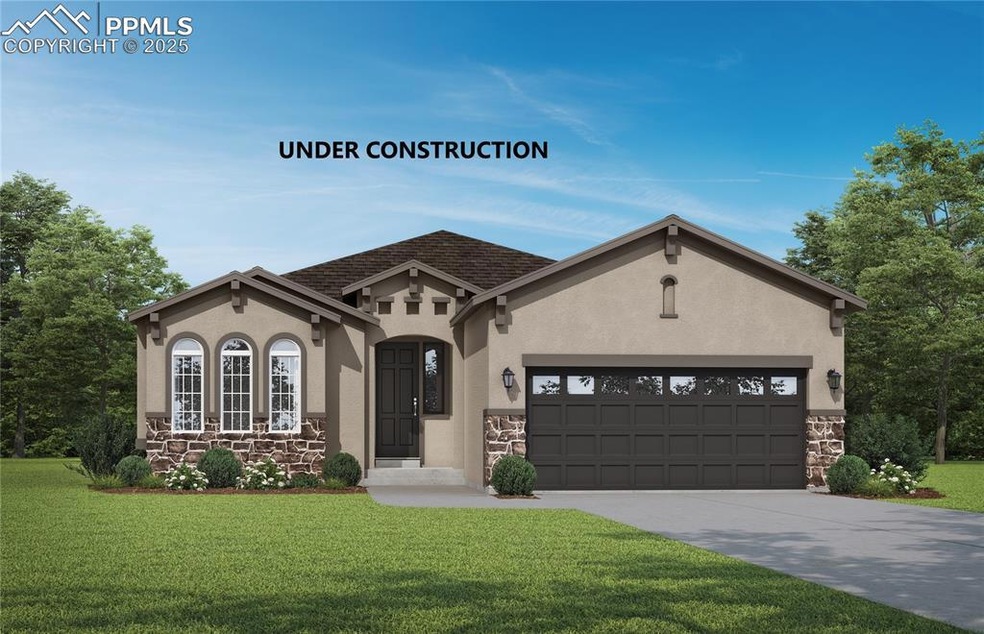 View of front of house with a garage and a front y