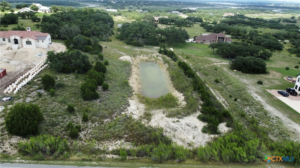 2.15 Acres with a natural aquifer within.
