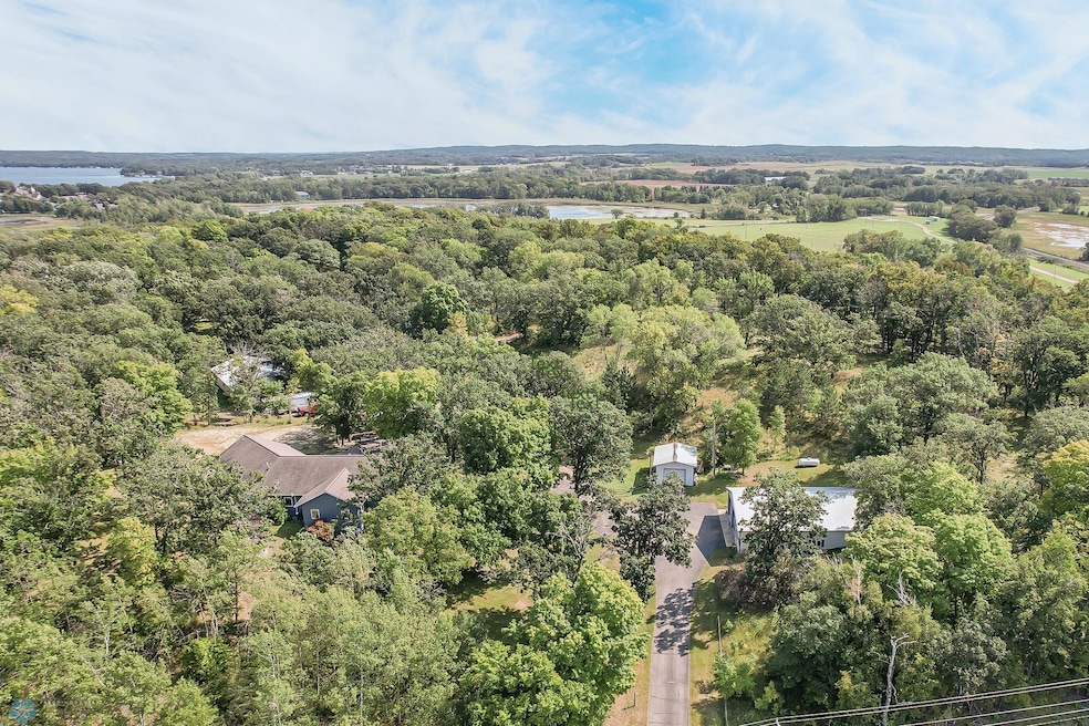 Incredible property! Shoreline on 2 separate lakes, mature trees, outbuildings galore, multiple building sites and 38+ acres!