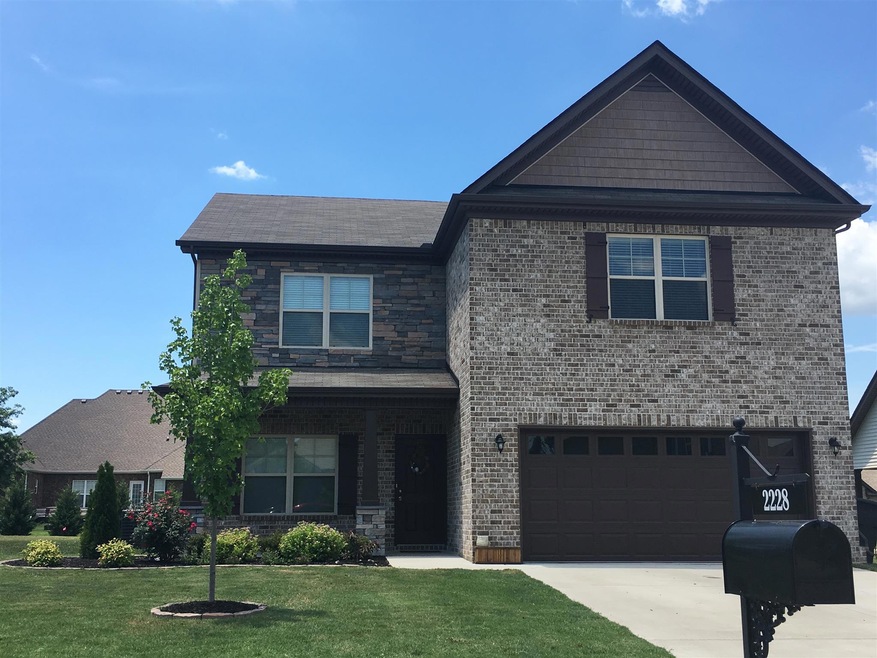 Beautiful 4 Bedroom home with 2.5 Bathrooms, 2 Car garage with a Brick and Stone front on a large level lot!