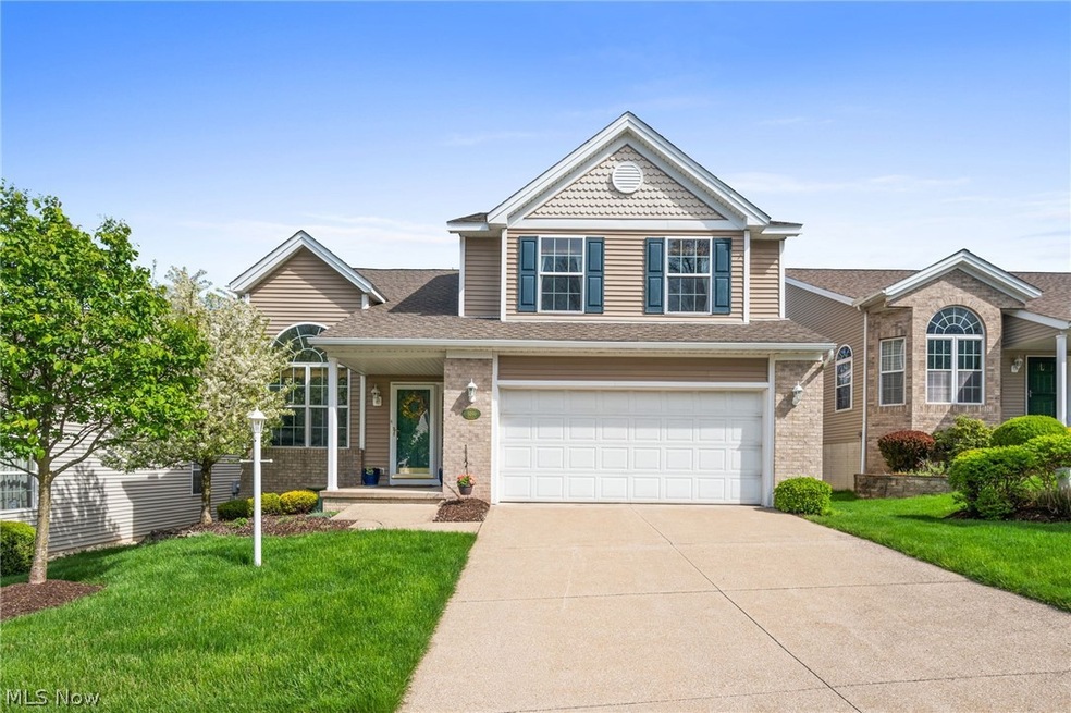 View of front facade with a garage and a front yard