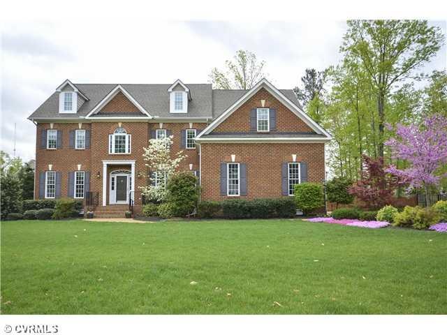 Exterior Front - This stately Transitional has bri