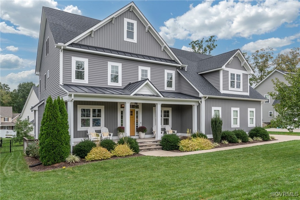 Craftsman inspired home with a front yard and cove