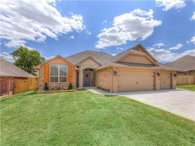 Exterior Front. Stacked stone accents and 3 car garage.
