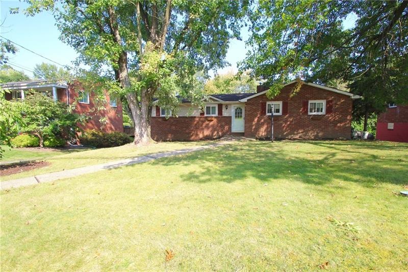 Welcome home to a sprawling front yard with large 