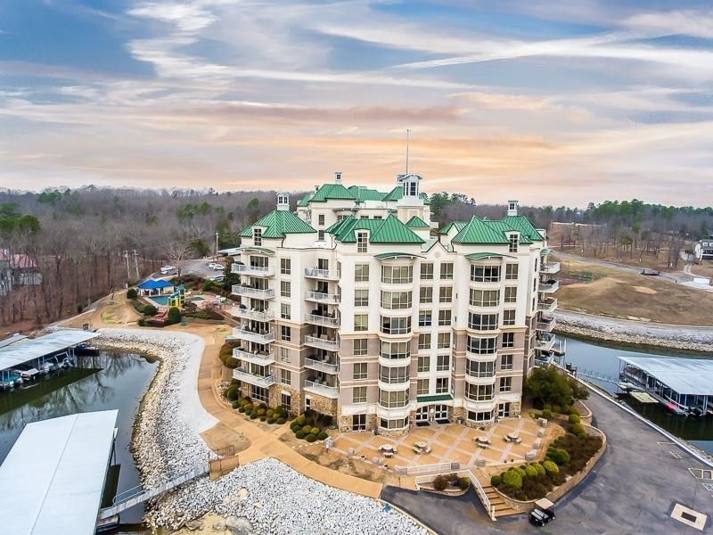 Property at dusk featuring a water view