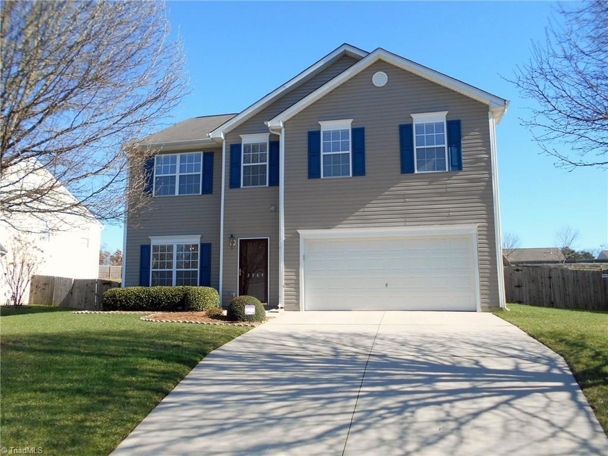 Low maintenance, vinyl home with two car attached garage with paved drive.