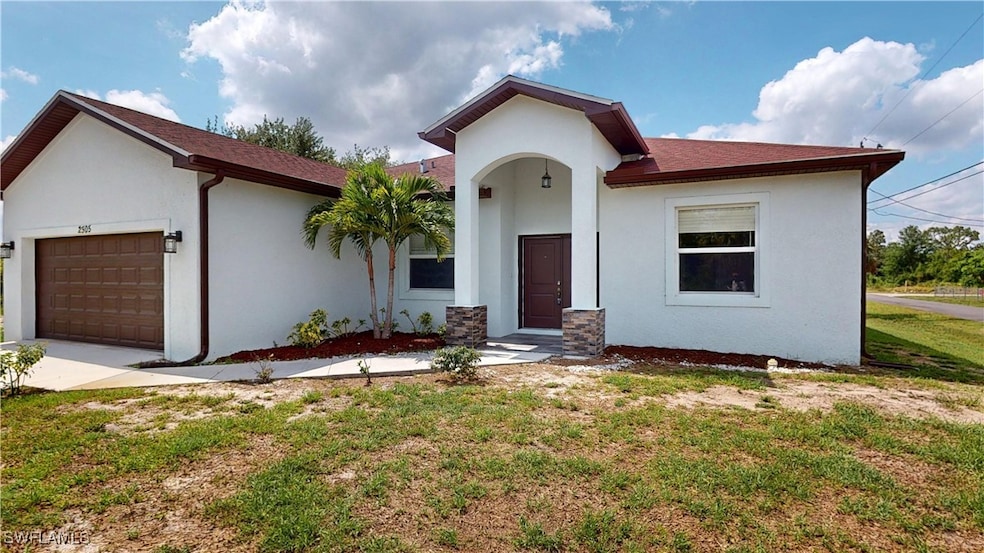 View of front of property with stucco siding, an a