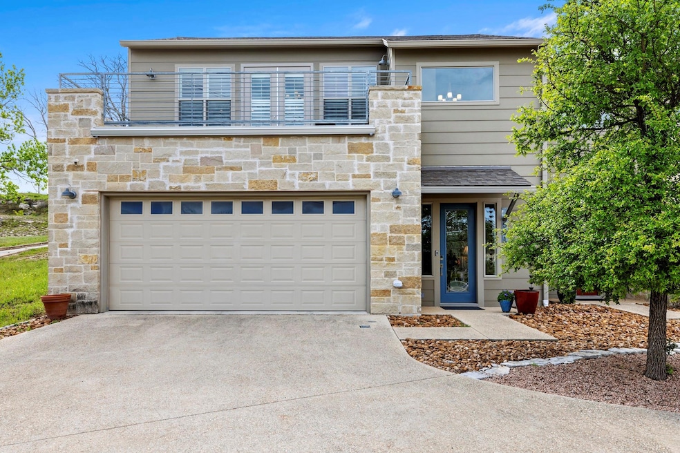 Contemporary house featuring driveway, stone sidi