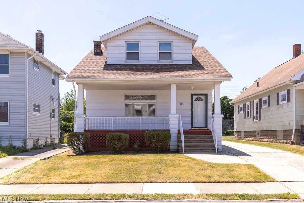 Bungalow-style house featuring covered porch and a front yard