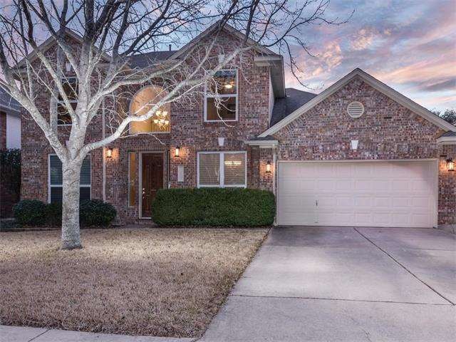Beautiful curb appeal with mature trees and landsc