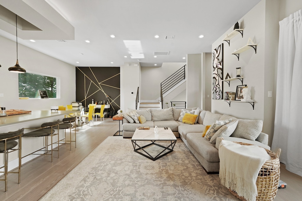 This modern living area features an open floor pla