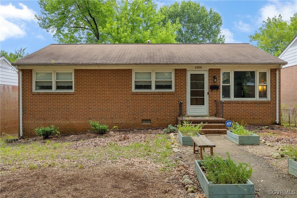 View of front of house with a shingled roof, a gar