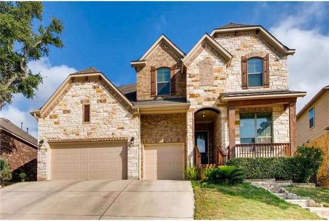 Beautiful stone and brick home with stone steps le