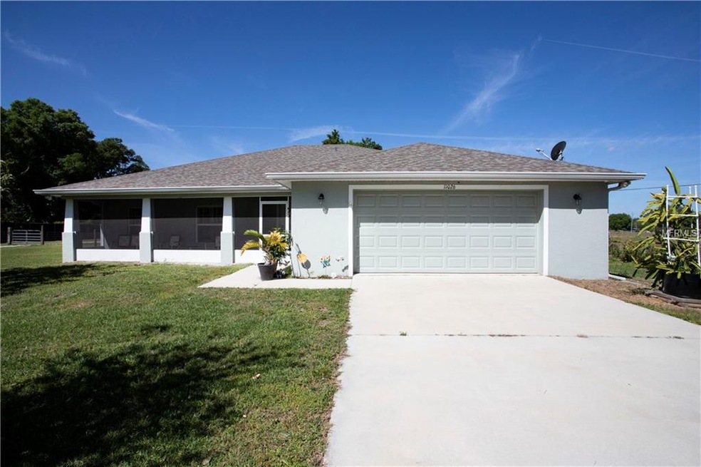 Front exterior showing screened porch.