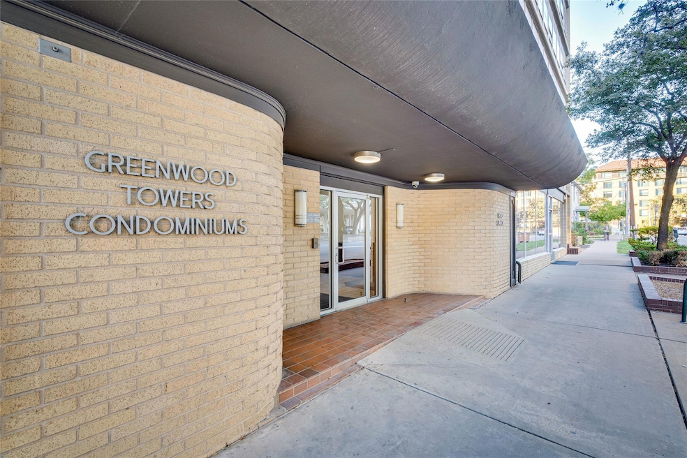 View of exterior entry featuring brick siding