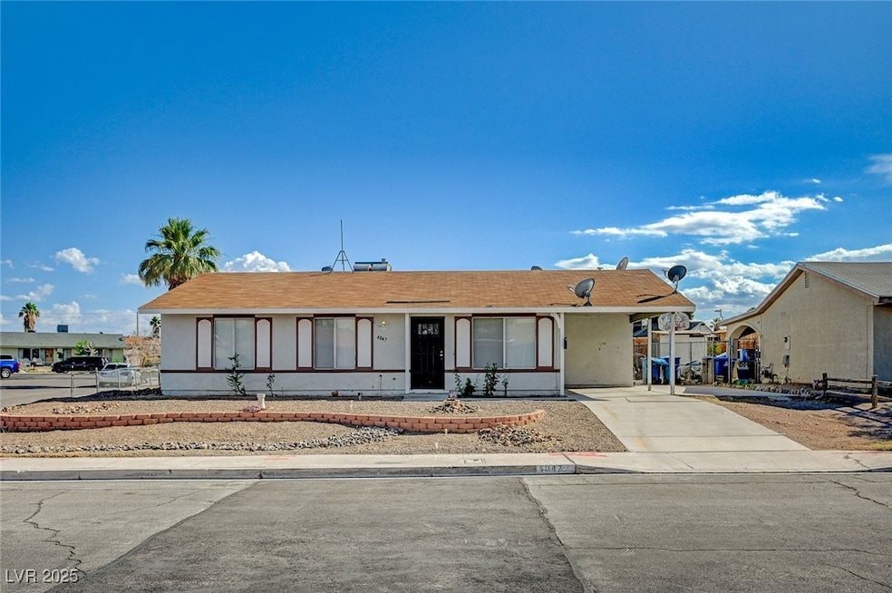 Single story home featuring driveway, an attached