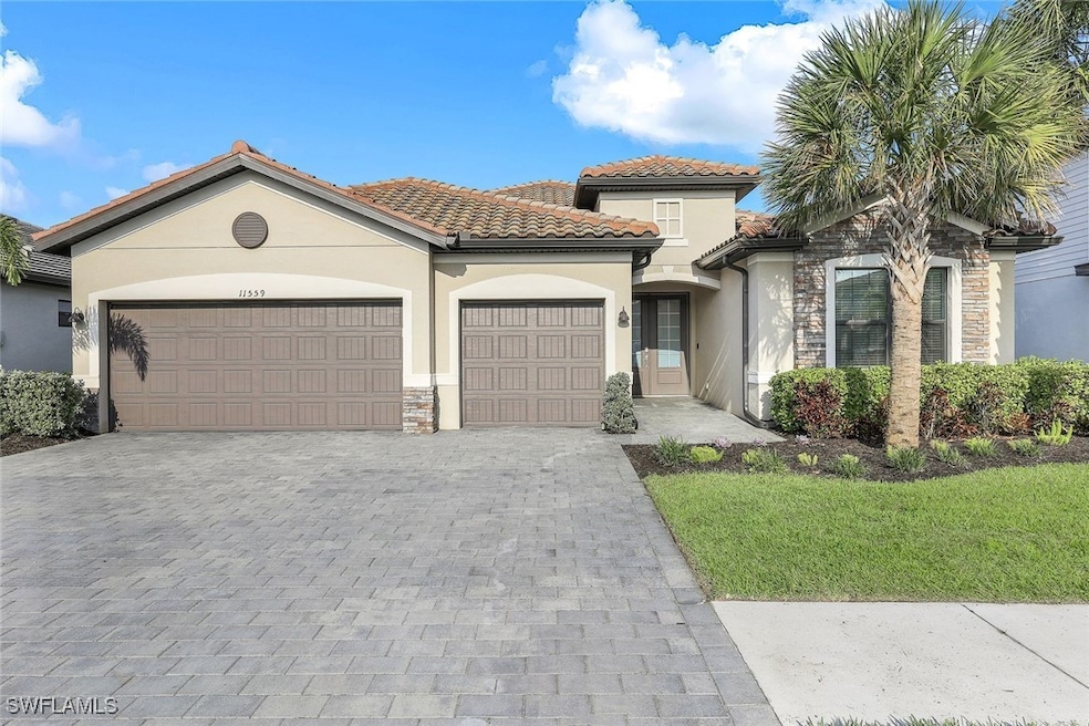 Mediterranean / spanish-style home featuring a gar