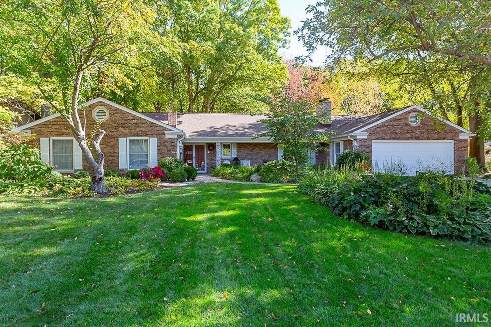 A lovely, tastefully landscaped home with blooming