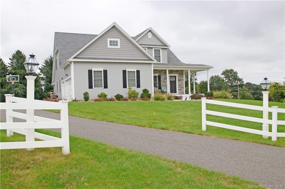 Set on a corner lot, this 7-year old Colonial/Cape