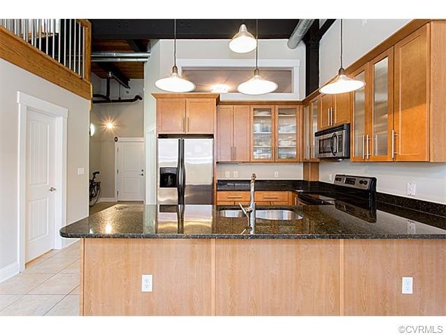 Soaring ceilings in the open kitchen-living room a