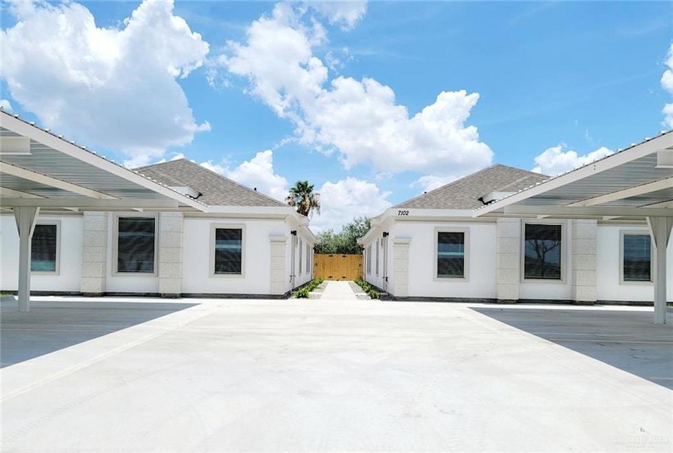 View of patio with a carport