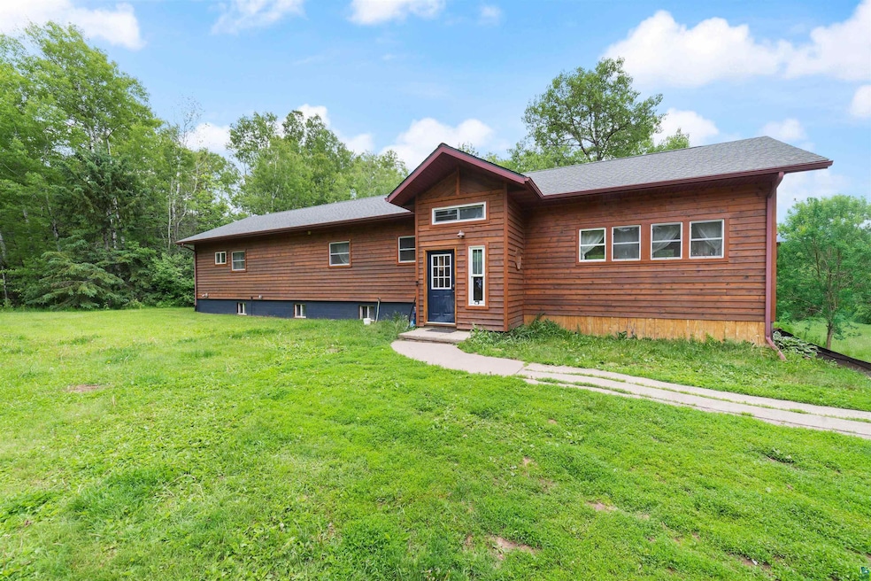 Rustic home with a front lawn