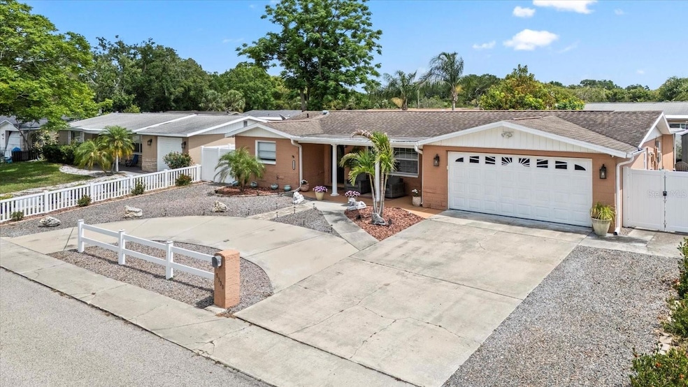 Front view with large driveway