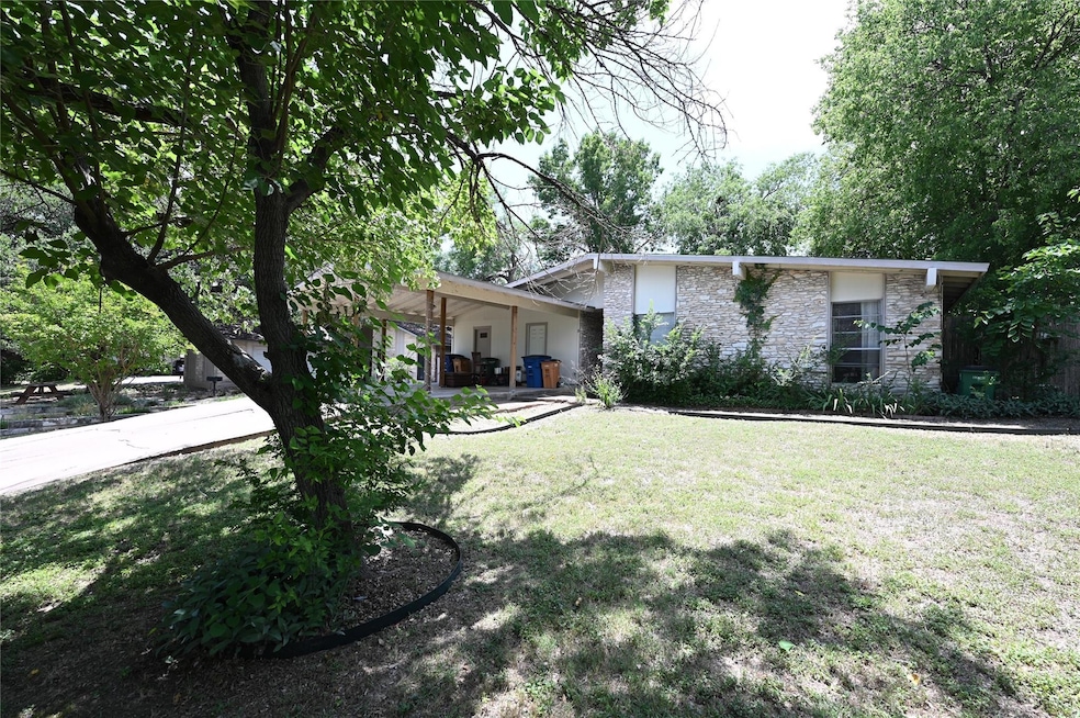 View of front of property with stone siding and a