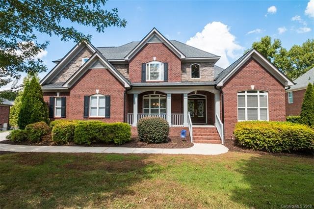 Custom home with large covered front porch, three 