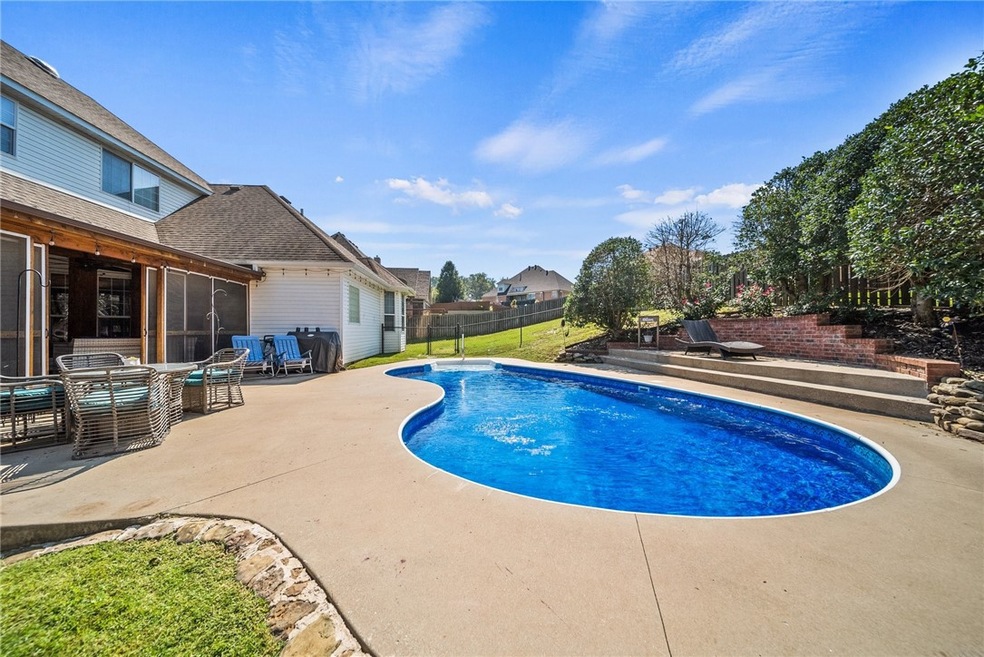 Home with in-ground pool in Bentonville.  Fantastic location with easy access to I-49 Hwy.