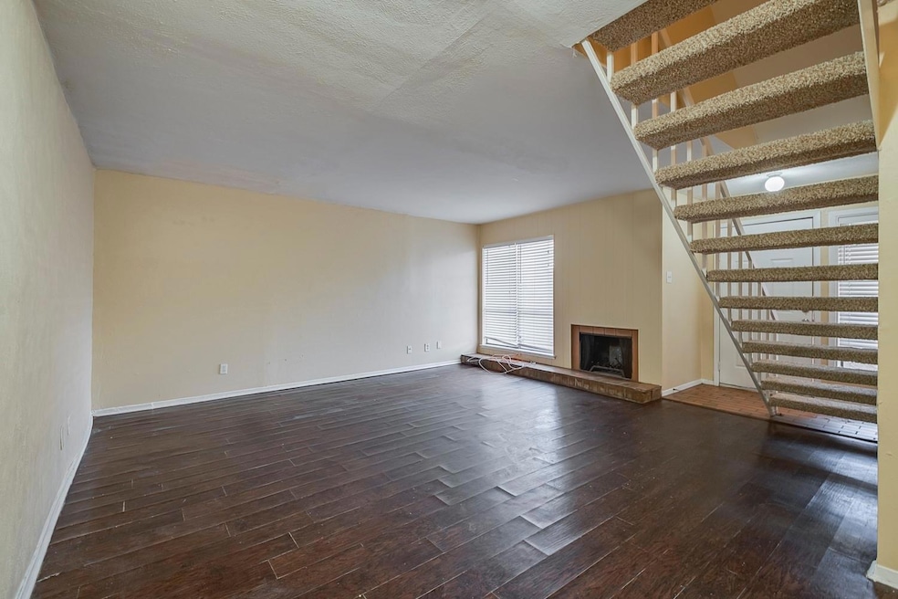 Living room featuring dark wood-type flooring.