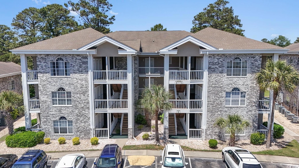 View of building exterior featuring uncovered park