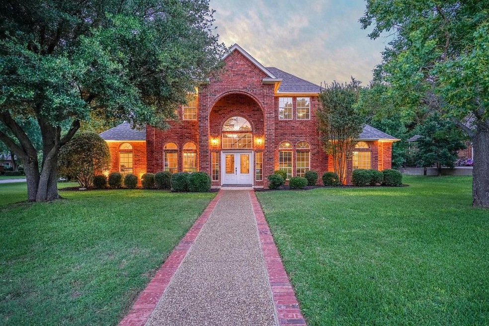 Prepare to be greeted by a meticulously landscaped