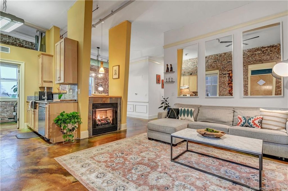 Open and sunny with high ceilings, exposed brick a
